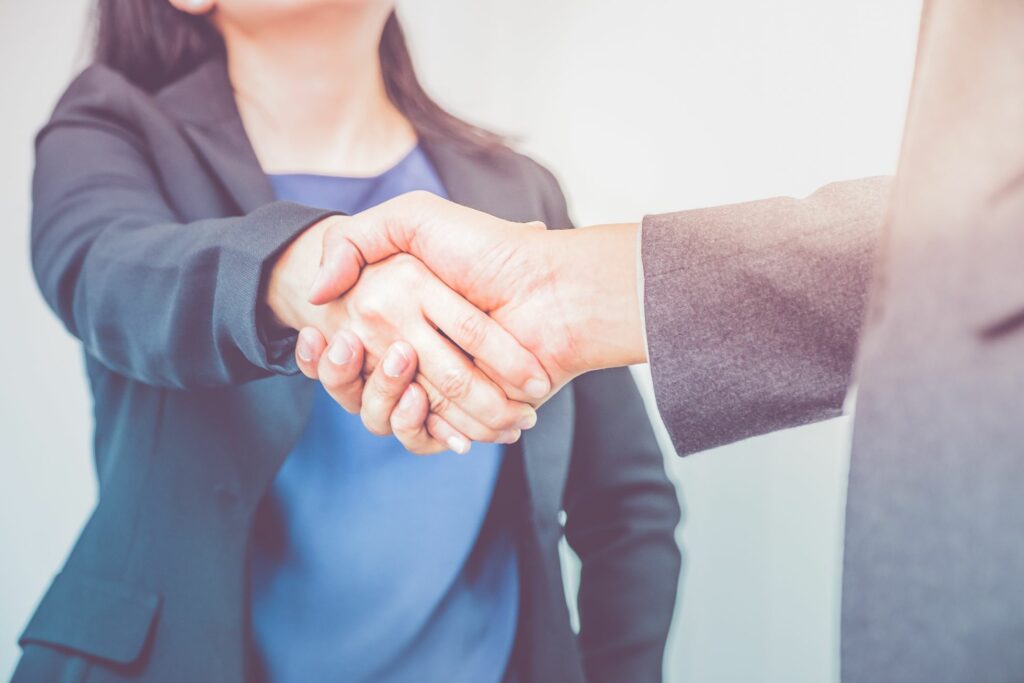 Business woman hand shake